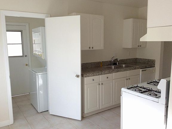 Kitchen with and laundry room with stackable washer/dryer