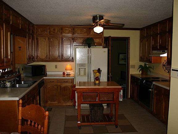 Kitchen has new tile and large walk-in pantry