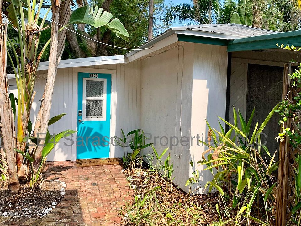 Main entry door next to laundry shed