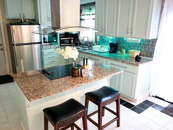 Kitchen area granite counter tops with Island.