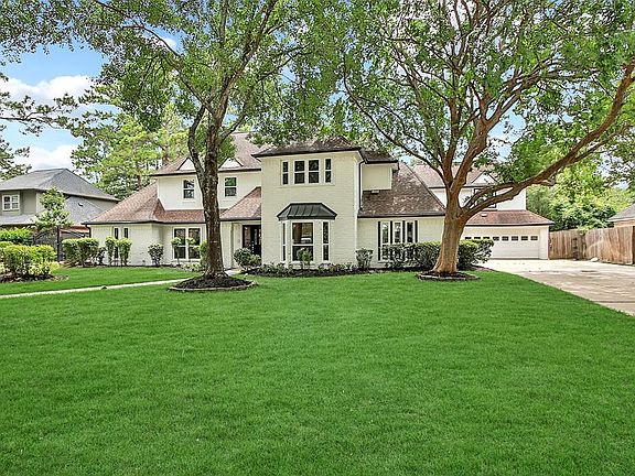 SHADED LOT: One of the features that residents love about Champion Forest are the big trees and established yards. This home is no exception, with a pretty canopy of trees front and back. A full yard sprinkler system will help to keep this yard lush 