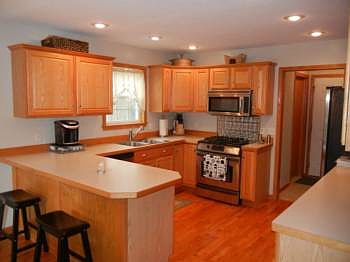 The kitchen is quite large and is close to the laundry room and access to the garage.