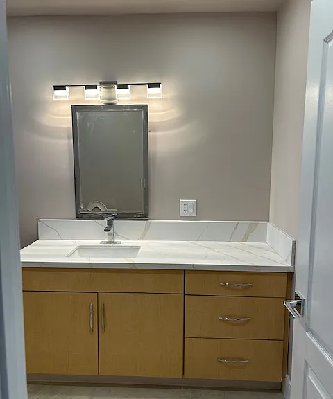 bath room with lots of storage
Quartz counter top