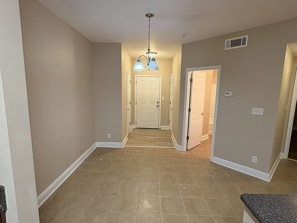 Condo Entrance way into kitchen with brand new tiling.