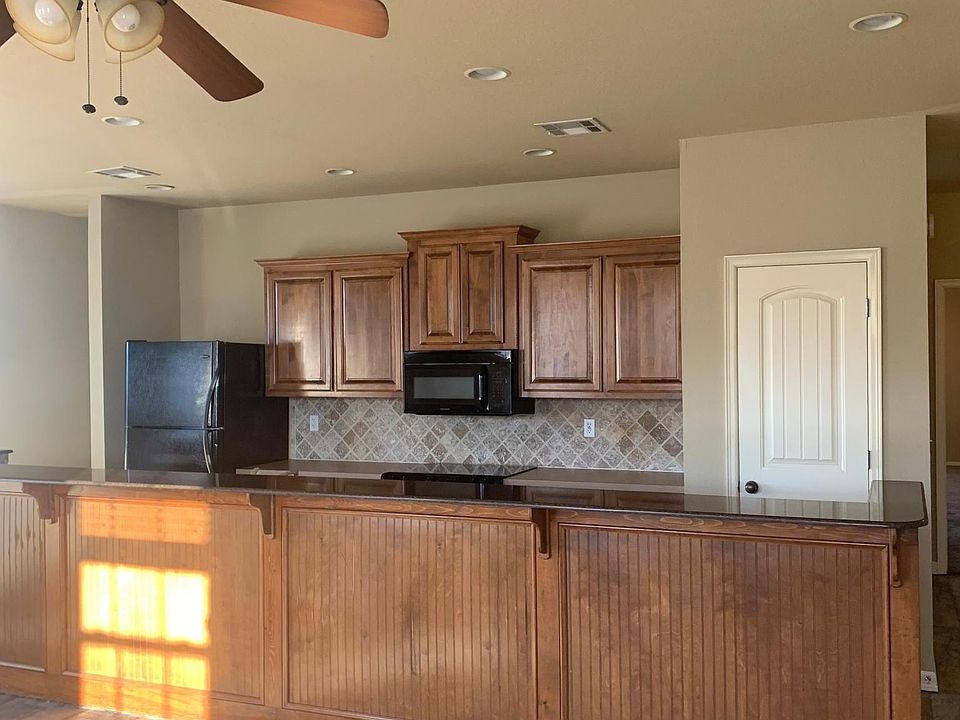 Amazing kitchen open to living area with natural light all around.