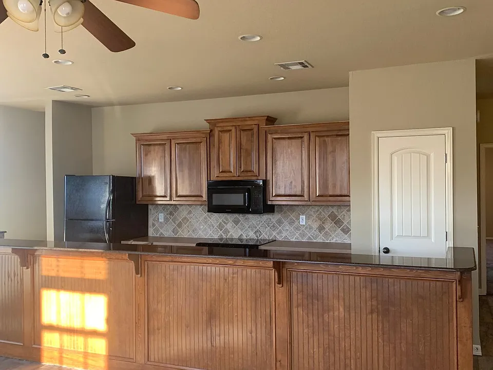 Amazing kitchen open to living area with natural light all around.