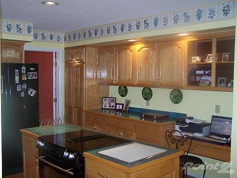 Custom oak cabinetry in kitchen.