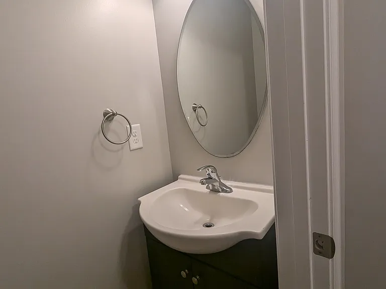 half bath downstairs off kitchen (updated vanity and new laminate flooring not pictured)