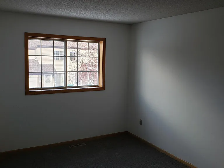 Second bedroom with blinds.