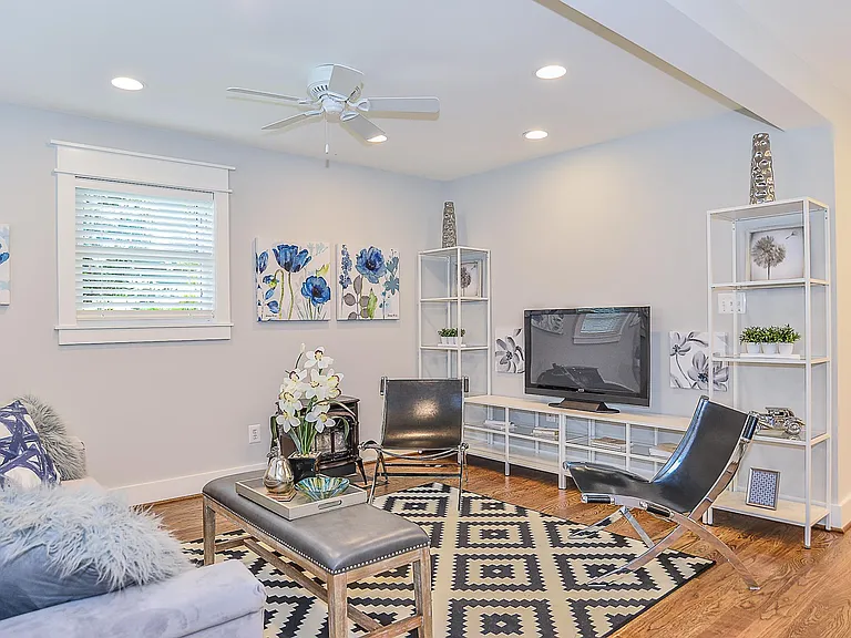 Living room w wood look gas burning fireplace