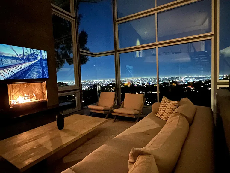 Zen-Inspired Living Room with Fireplace & Private Balcony