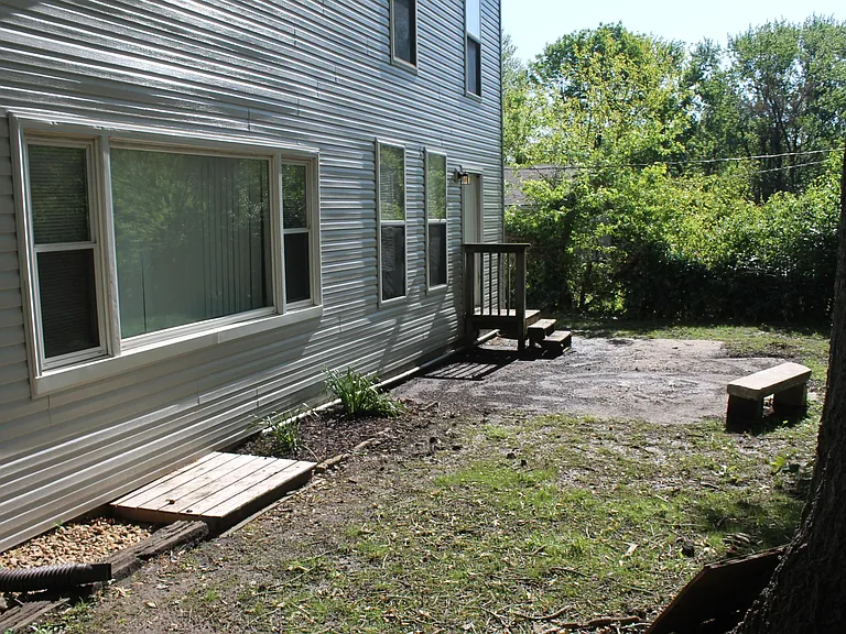 Large fenced backyard with patio