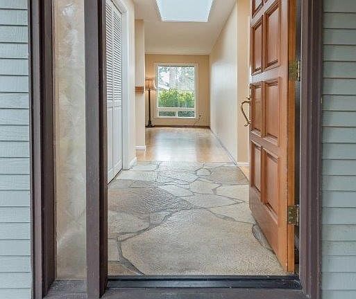 If you prefer natural tones and materials...you'll love this place with rock entry, real hardwood floors recently refinished, and solid wood siding exterior.