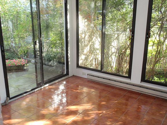Sunroom leading to slate terrace