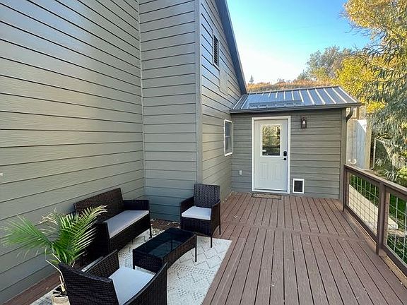 Top unit private deck and side entrance to mudroom w/doggie door.