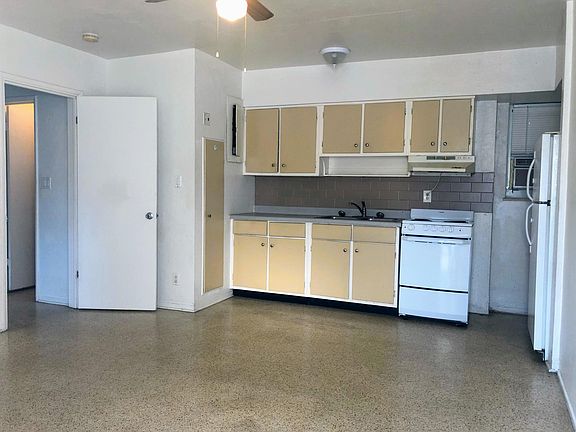 Combined kitchen & living room space. Leading to separate bedroom.