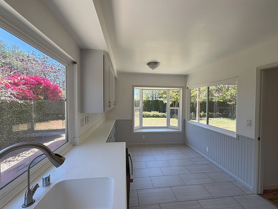 The sunny breakfast nook overlooks the backyard.