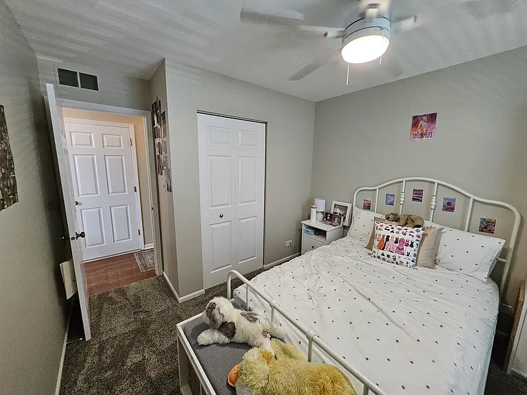 Ceiling fan with light in the guest bedroom