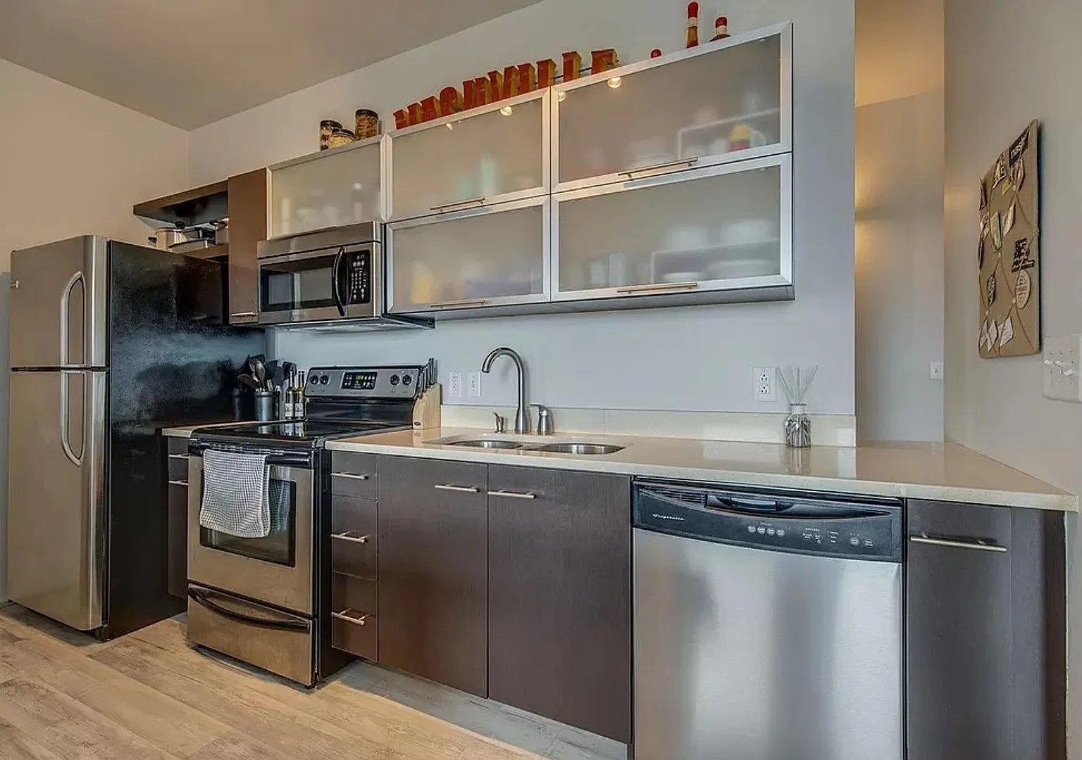 1 Bed/1 Bath Condo at 5th and Main, Assigned Parking, Washer/Dryer/Covered Balcony — Photo 3
