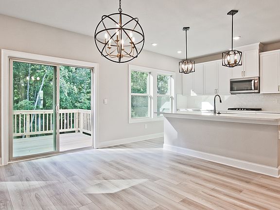 The kitchen island overlooks the great room and dining area.