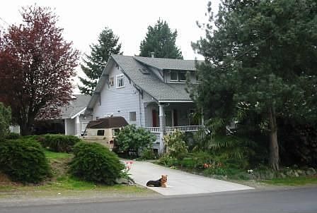 Front porch views landscape buffer between home and street