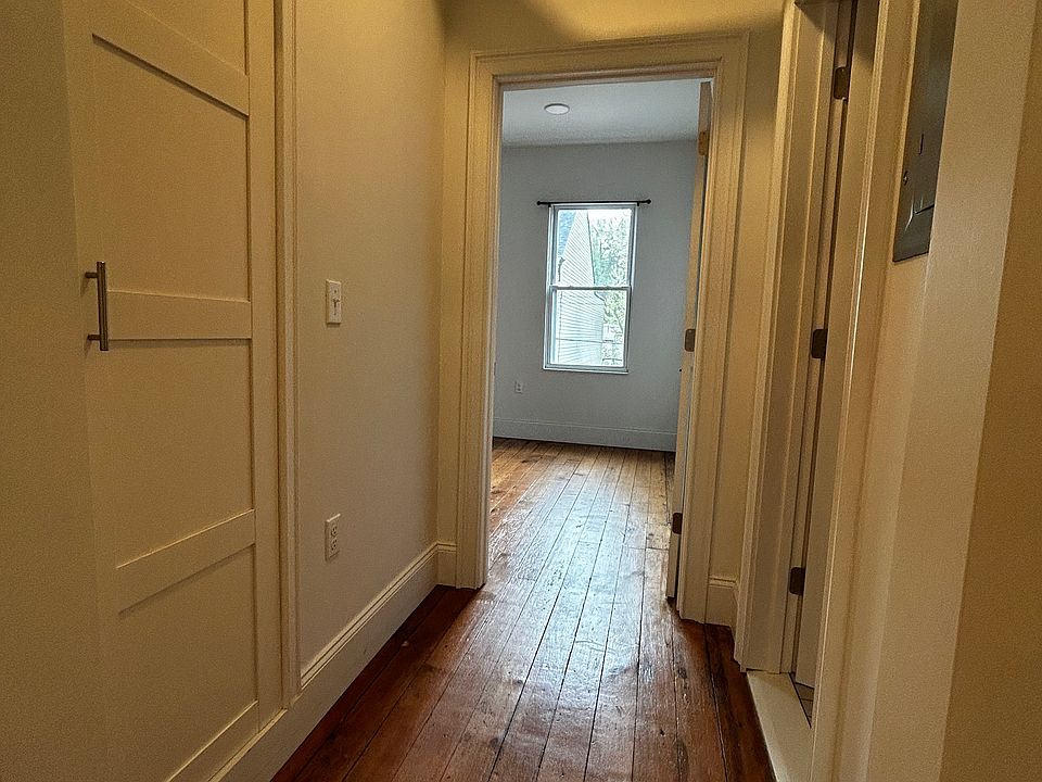 Hallway from Living Room to Master Bedroom - Coat closet is on left - Bath on right
