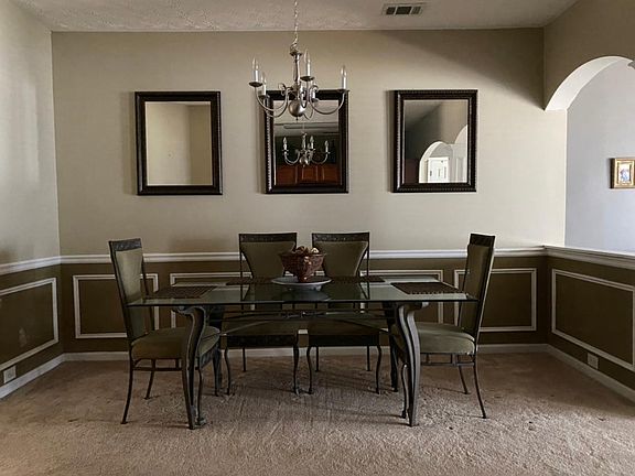 The dining room can comfortably accommodate a party of six and provides great sightlines to the living room.