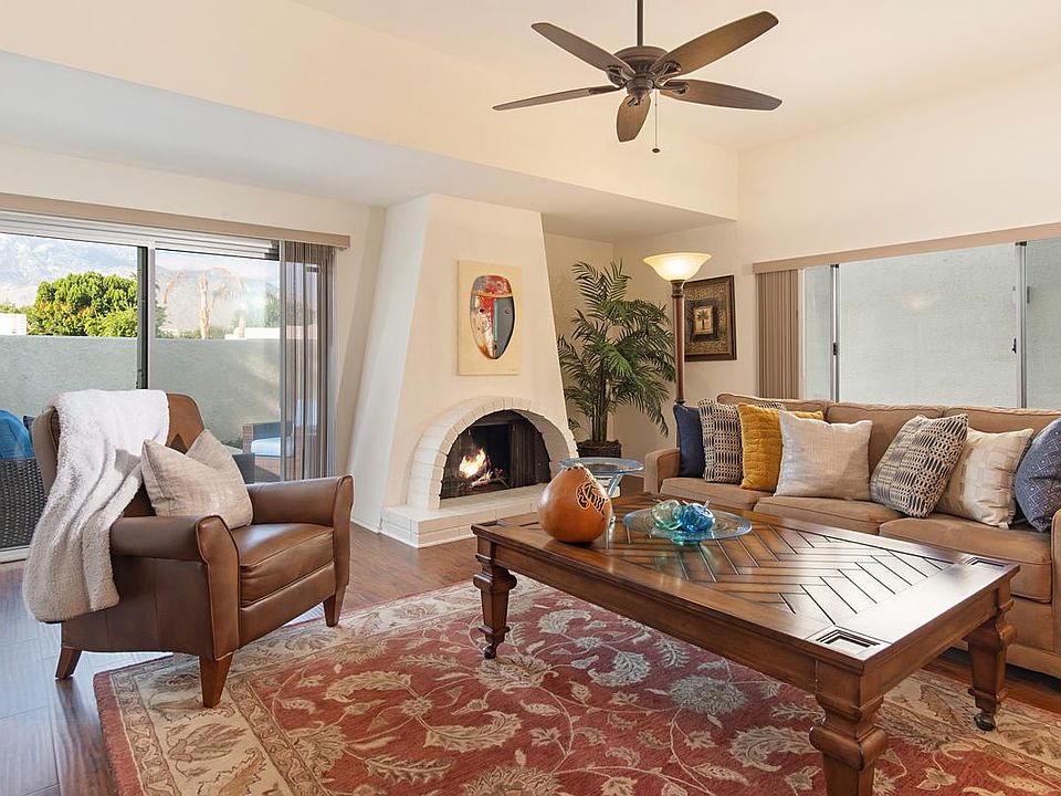 living room faces the mountains and has a working fireplace... walkout patio too!