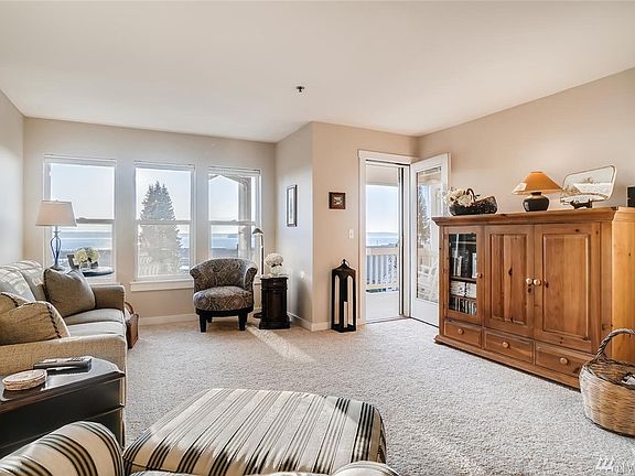 Open living room to capture the views of Puget Sound, Olympics & Pt Gardner Bay!