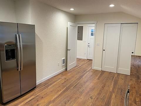 Kitchen pantry closet and doorway to laundry room