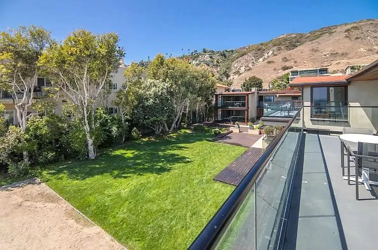 Views of the expansive grassy area from the side of the suite