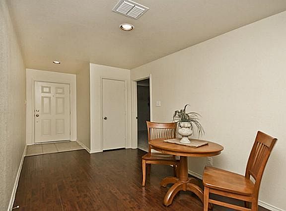 Beautiful entry and landing area with hardwood floors.