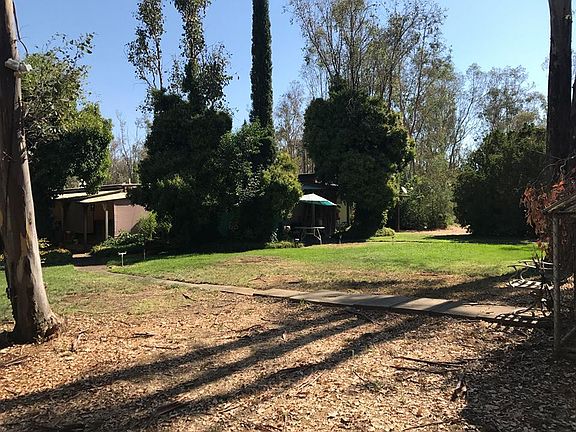 Around back of the home.