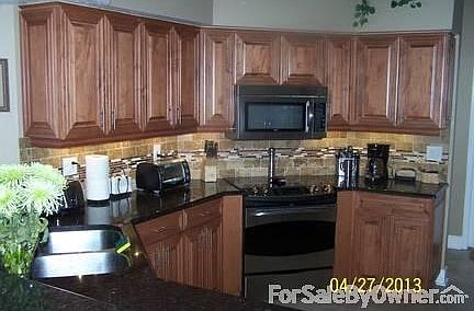 Completely remodeled kitchen
						:
						Stainless steel appliances, granite countertops, travertine/ glass back-splash.