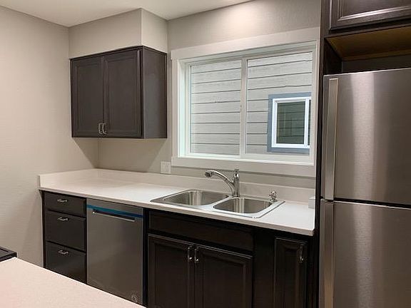 Newer Kitchen with stainless appliances. Soft close cabinet doors. Good storage. Open to dining and living room.