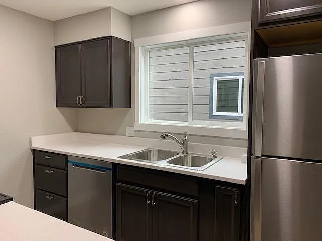 Newer Kitchen with stainless appliances. Soft close cabinet doors. Good storage. Open to dining and living room.