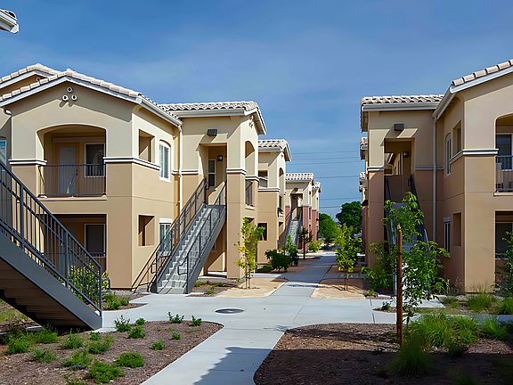 Stroll through inviting pathways lined with greenery in the vibrant and welcoming community.
