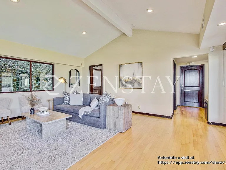 Sun-filled living area designed for comfort, gathering, and easy entertaining