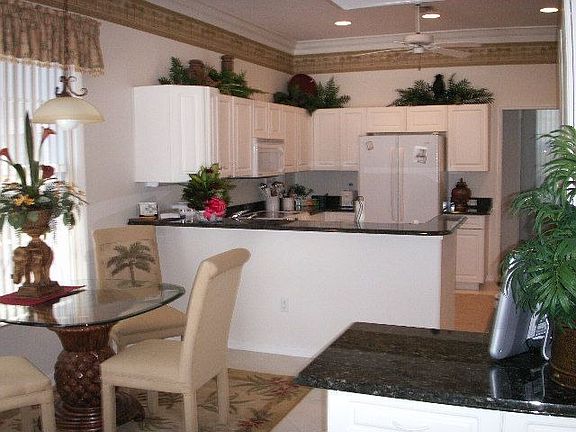 Upscale Kitchen with New Appliances and Marble Counters