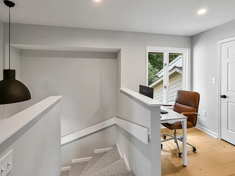 Stairs to upstairs with nook, currently being used as a second office