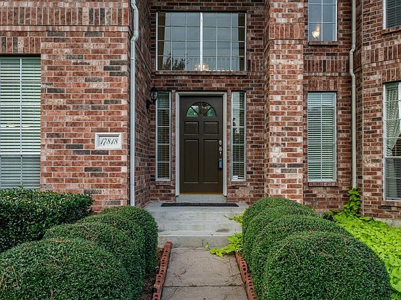Covered front porch greets you home!