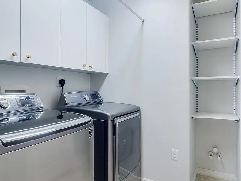 The stainless steel dryer broke and has since been replaced with a white dryer