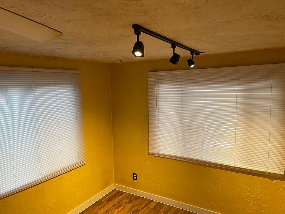 Warm adjustable track lighting in living space