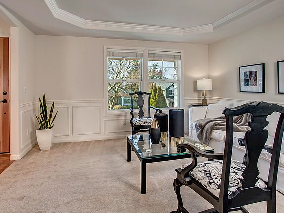 Coved ceilings, graceful columns, and an extensive use of wa