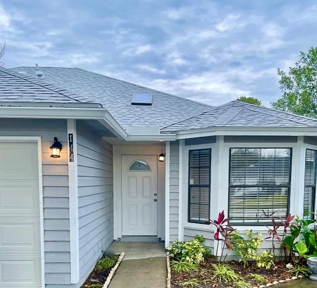 Lovely cottage residence. End of a quiet cul-de-sac. Screened patio overlooks water. Single story with attached garage and additional parking pad. Home living, not apartment living.
