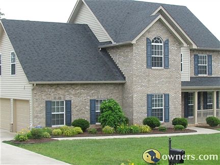Entering driveway view of home