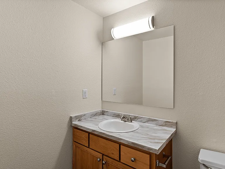 Modern bathroom vanity with sleek lighting and elegant marble countertop. Modern bathroom vanity with sleek lighting and elegant marble countertop.