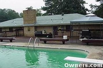 Rear of home showing deck and inground pool
