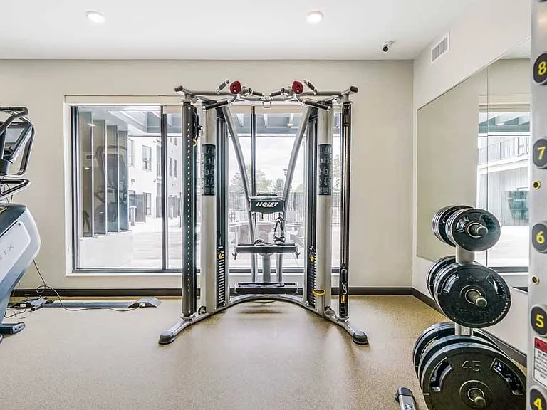 Build strength and stay motivated with a full set of weights and versatile training equipment at your fingertips.