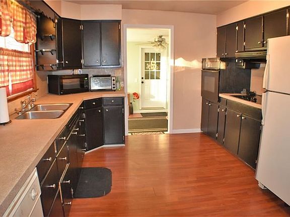 Spacious kitchen with updated textured counter tops and track lighting (shown in different picture). Cooktop stove with 5 burner